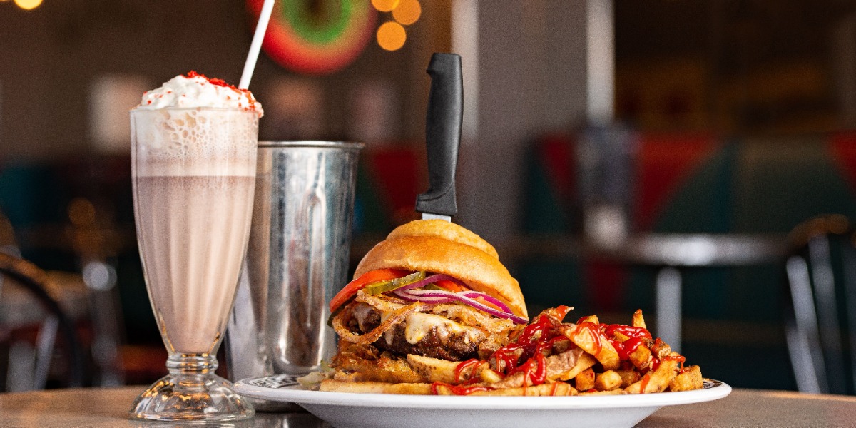 Burger on a plate with a milkshake