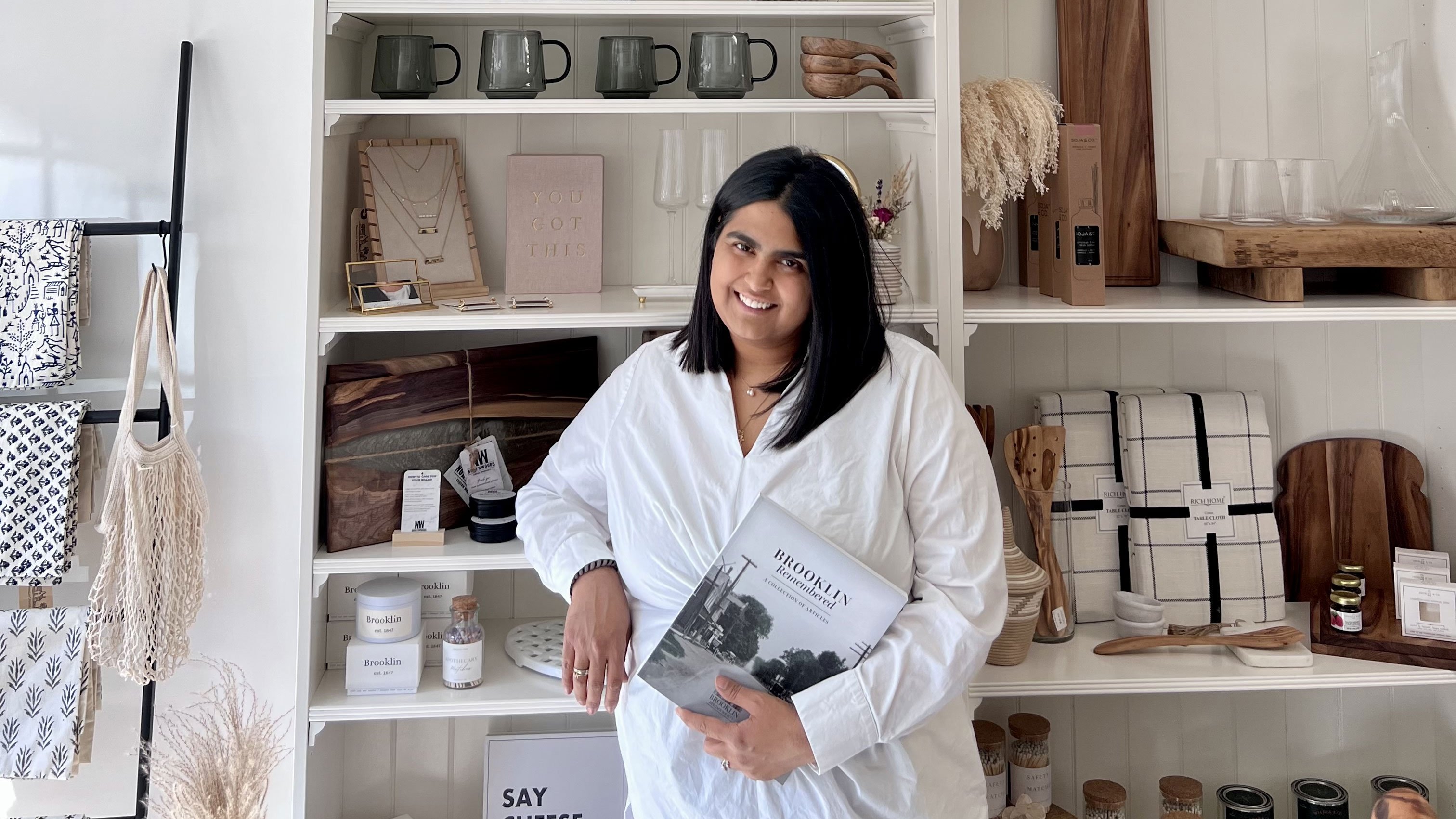 Brooklin General Store owner Rudy Yadav standing in front of products on shelf