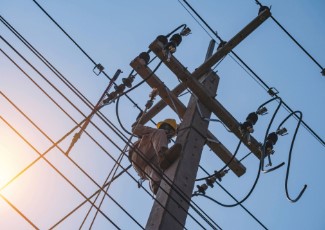 Power lines with a worker. 