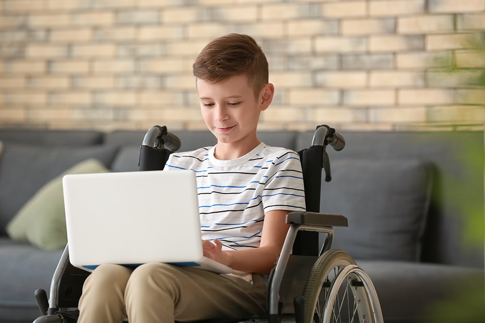 Young boy using laptop
