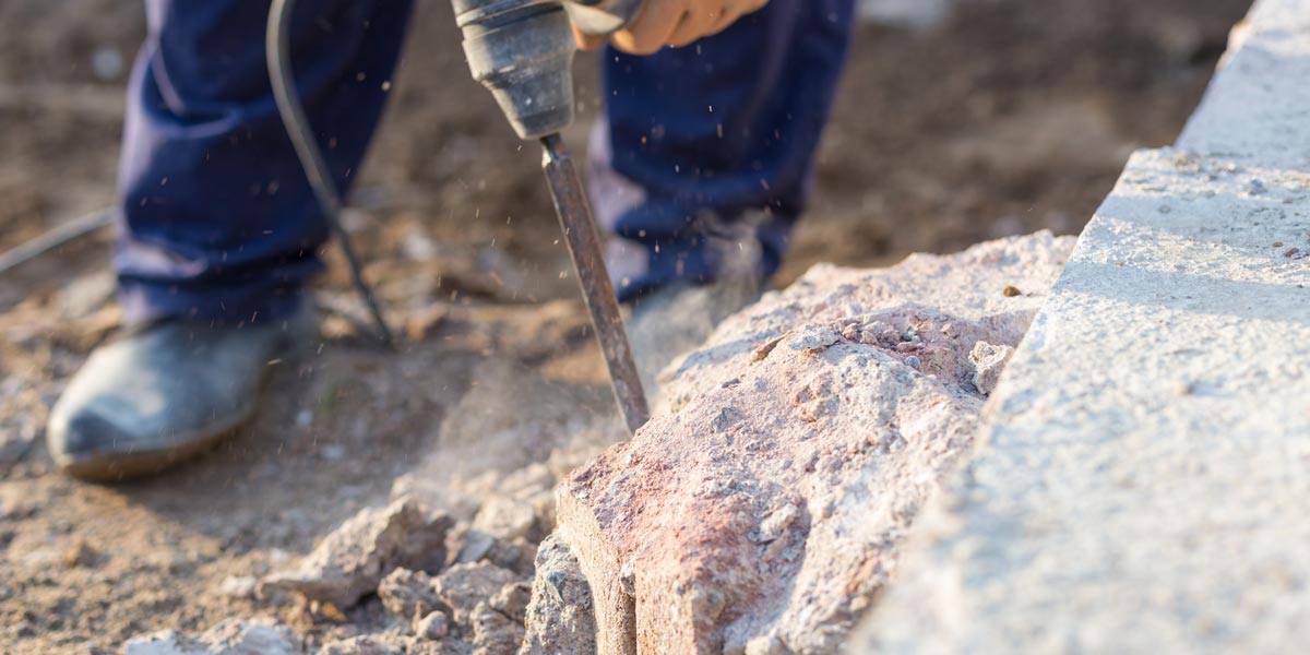 Person working with jackhammer 