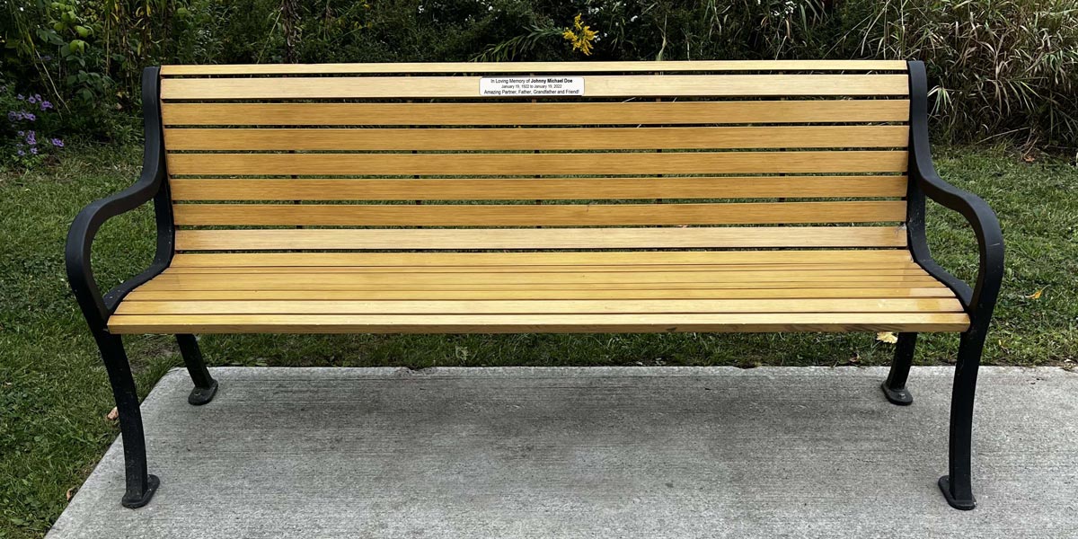 Whitby bench with plaque on it