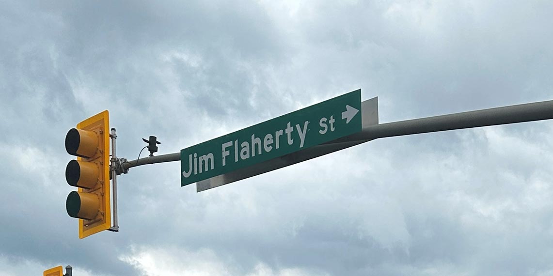 Staff changing a street sign name