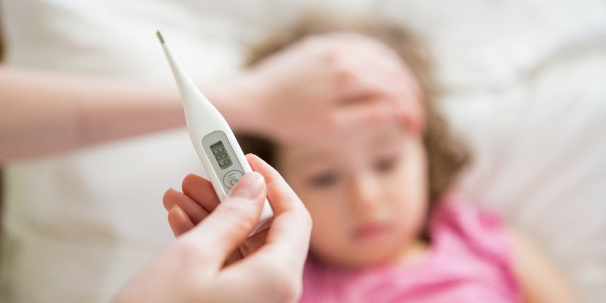 Taking the temperature of a sick child