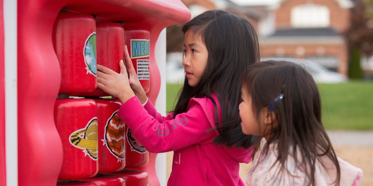 Close-up of two girls playing at a park