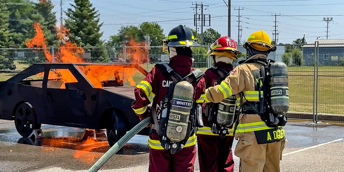 Girls putting out a fire at Camp Molly