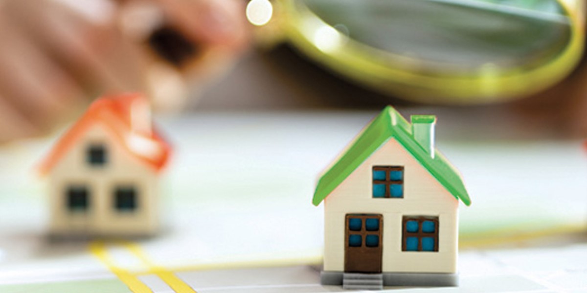 Illustrated image of homes under a magnifying glass