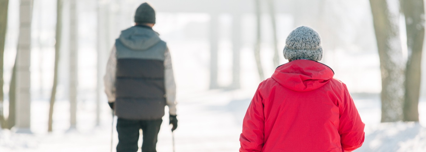 Two people walking in the snow