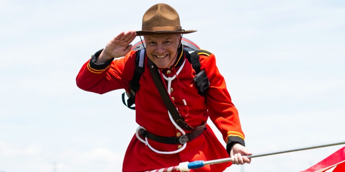 Man on stilts in mountie uniform