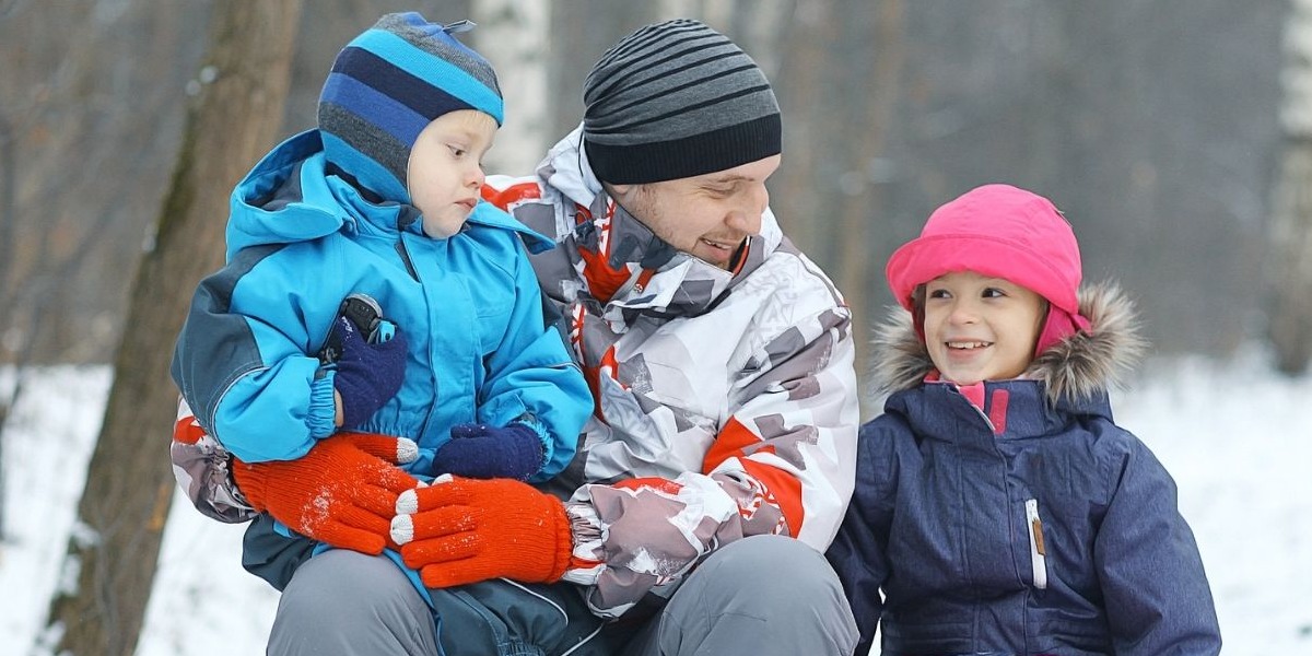 Dad with children outside in the winter