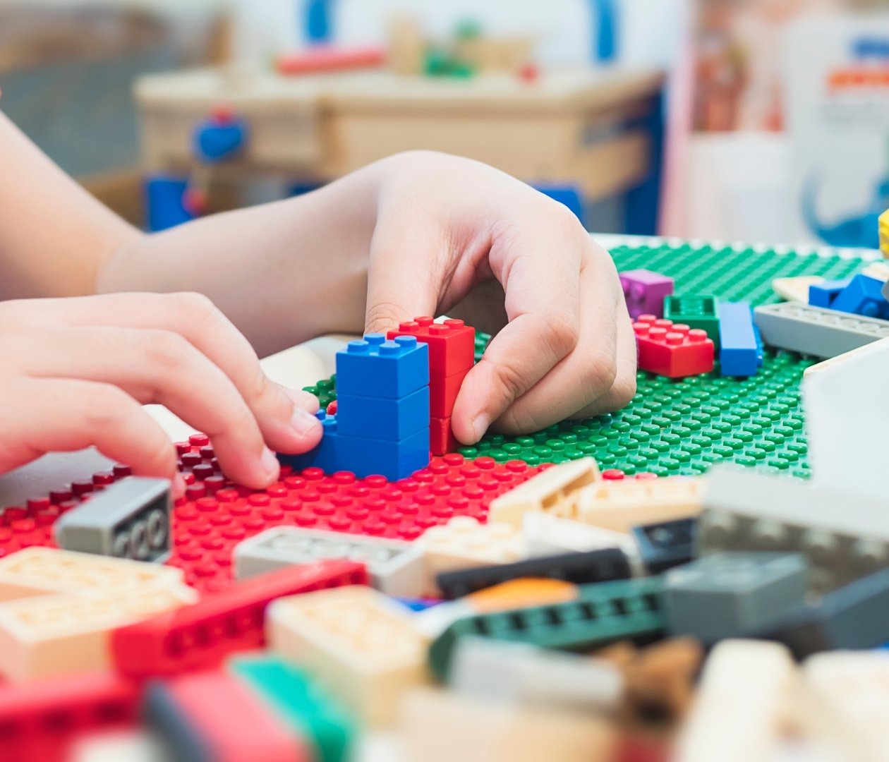 Child playing with Lego blocks