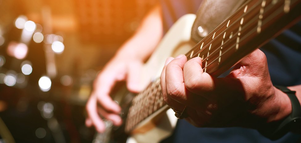 hand playing guitar