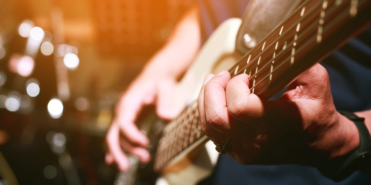 Hand playing guitar