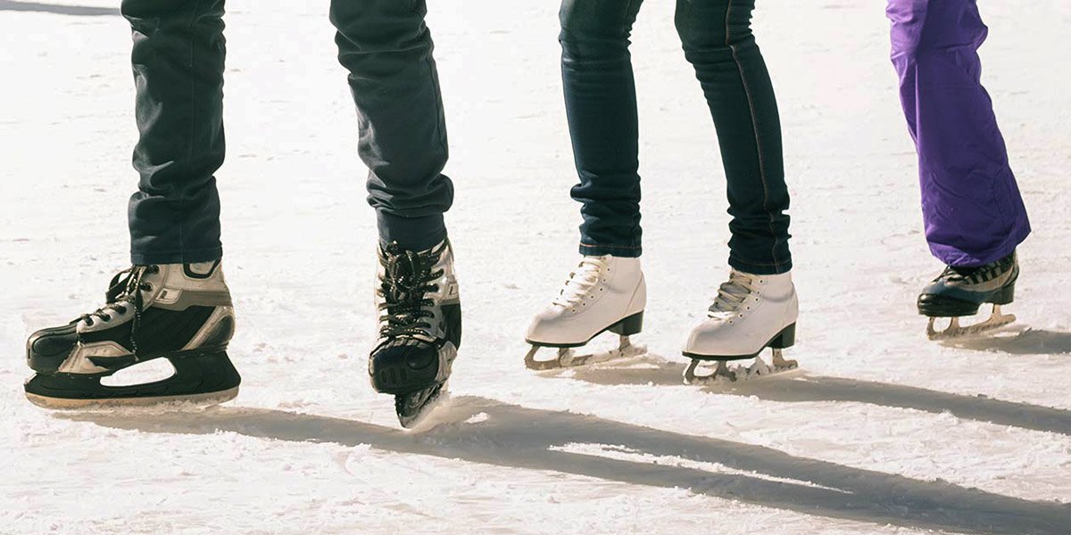 Two people skating on ice