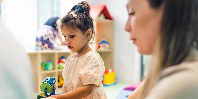 Young girl quietly playing 
