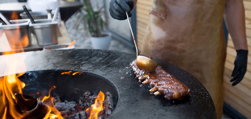 Ribs cooking on a hot stone