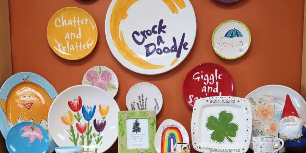 Various painted dishes on a shelf