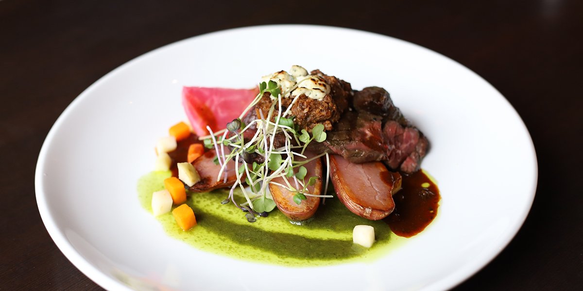 Steak and vegetables on plate 