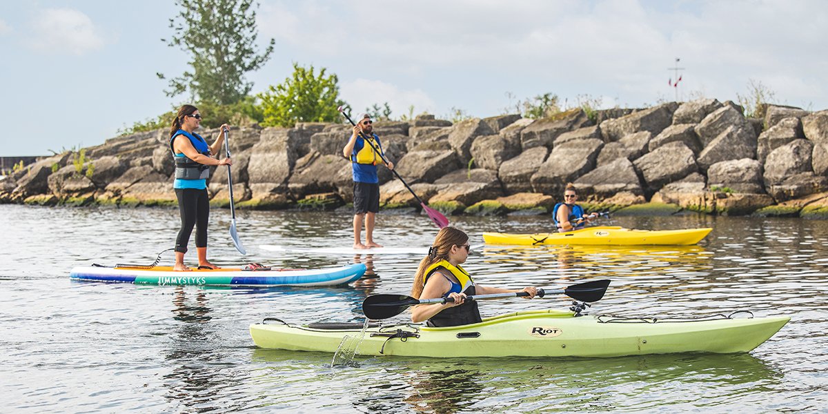 People in kayaks on lake