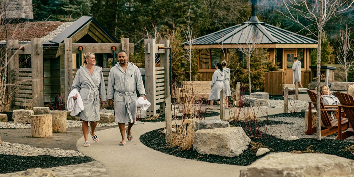 People walking in robes at spa