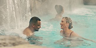 Two people in a pool at a spa