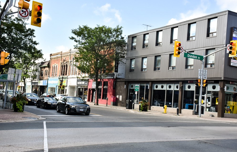 cars stopped at an intersection downtown