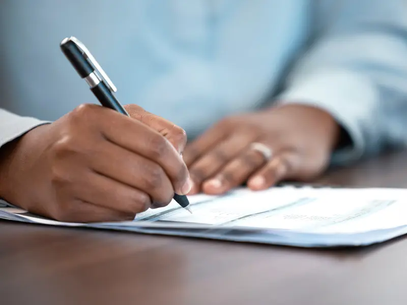 A person filling out an application