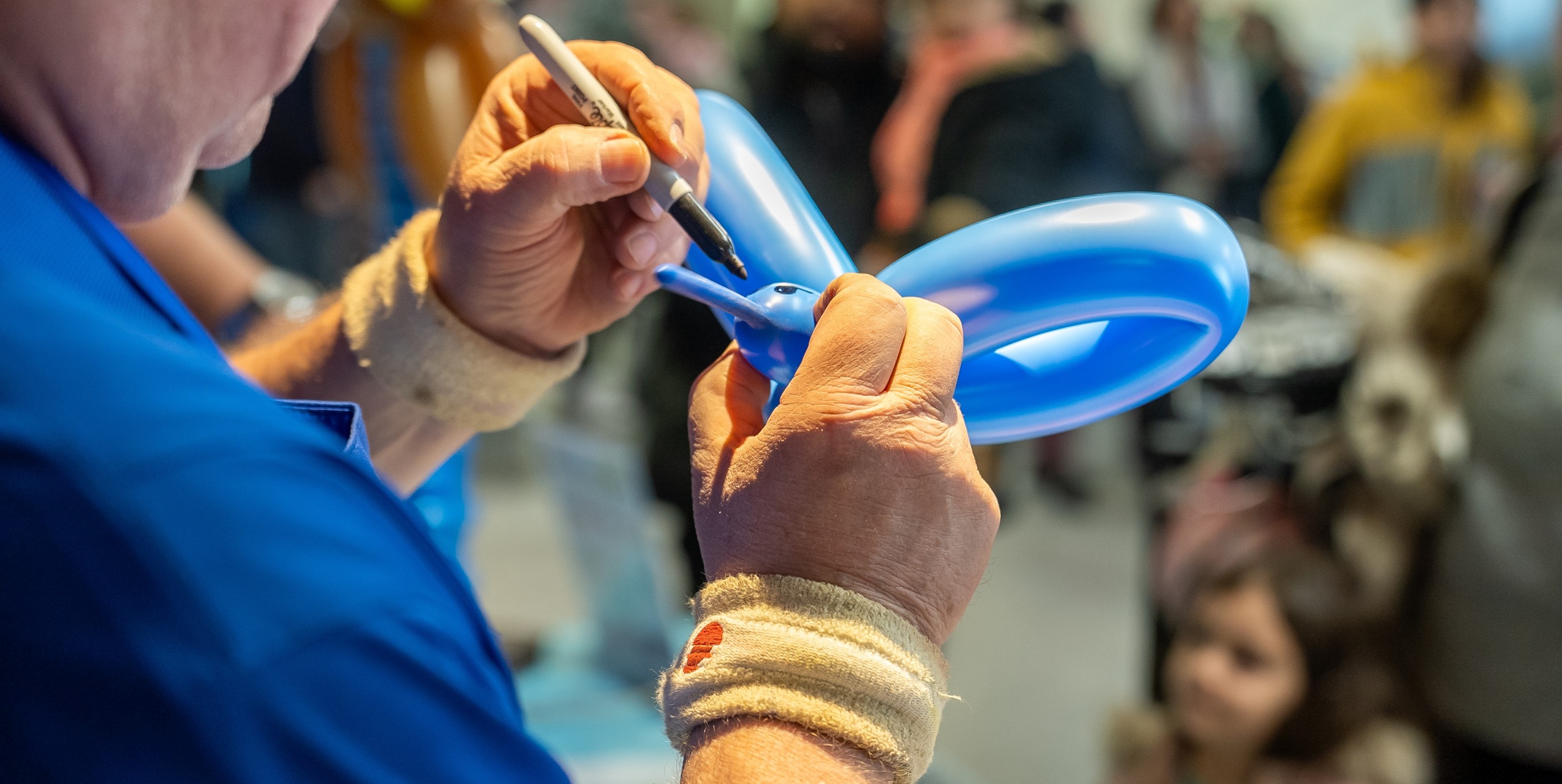 Person making balloon animals