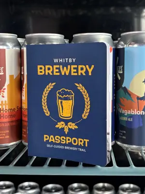 Brewery Passport Booklet inside fridge with beer cans
