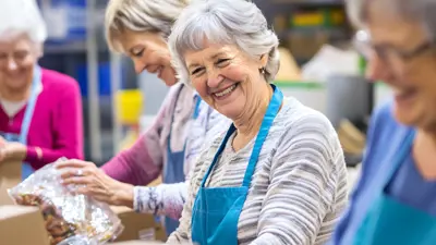A group of senior volunteers sorting food
