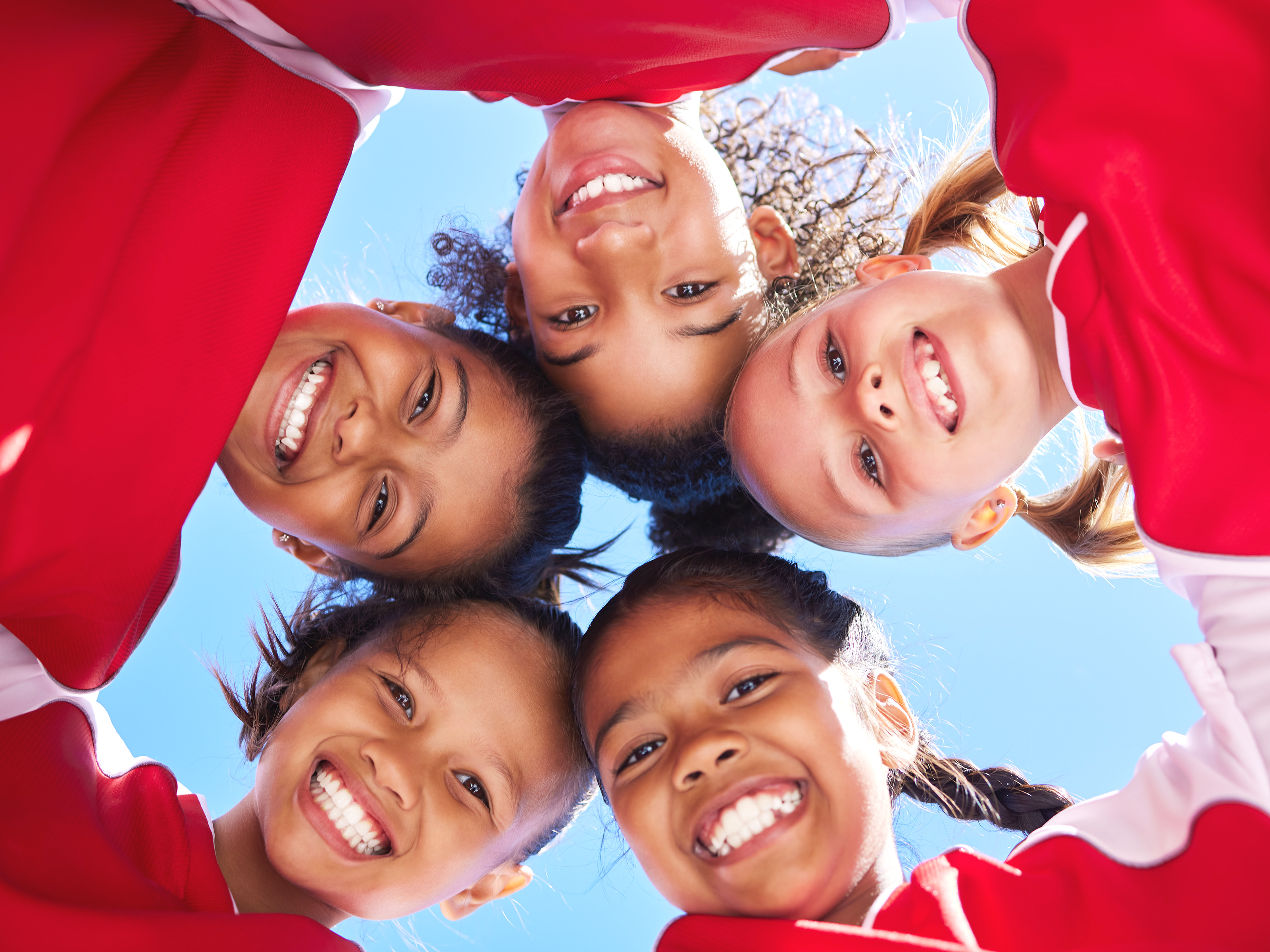 huddling youth sports group