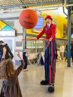Roaming entertainer holding giant basketball hoop