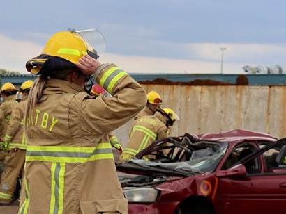 Dressed in full gear, a firefighter gets set for hands-on extrication practice.
