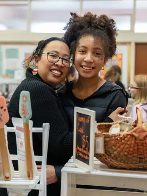 Market vendors smiling at camera 