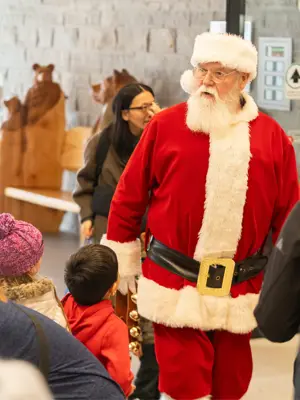 Santa greeting children at community centre