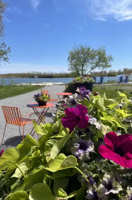 Images of bistro tables with planters by the waterfront